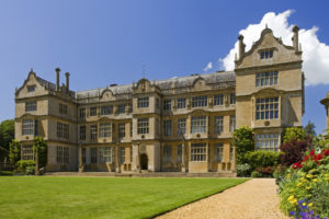 The east front of Montacute House, Somerset. This Elizabethan Ham-stone house was built in the late sixteenth-century for Sir Edward Phelips. The east front is in the usual Elizabethan "E" formation with projecting wings to either side and central frontispiece.