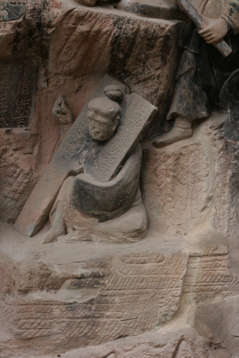 Dazu Rock Carvings, Sichuan. The instrument of torture is called a cangue.