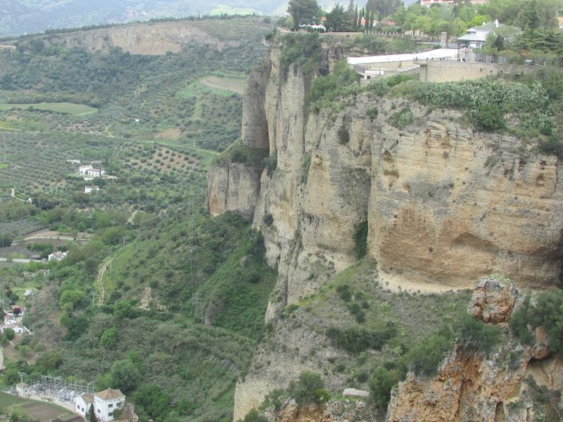 Ronda rising above farmlands below