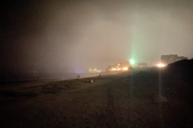 Nighttime on the beach as the fog rolls in.