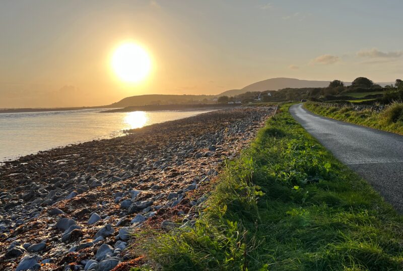 The sun rises over the Flaggy Shore on a day in late September 2023 in County Clare, Ireland.